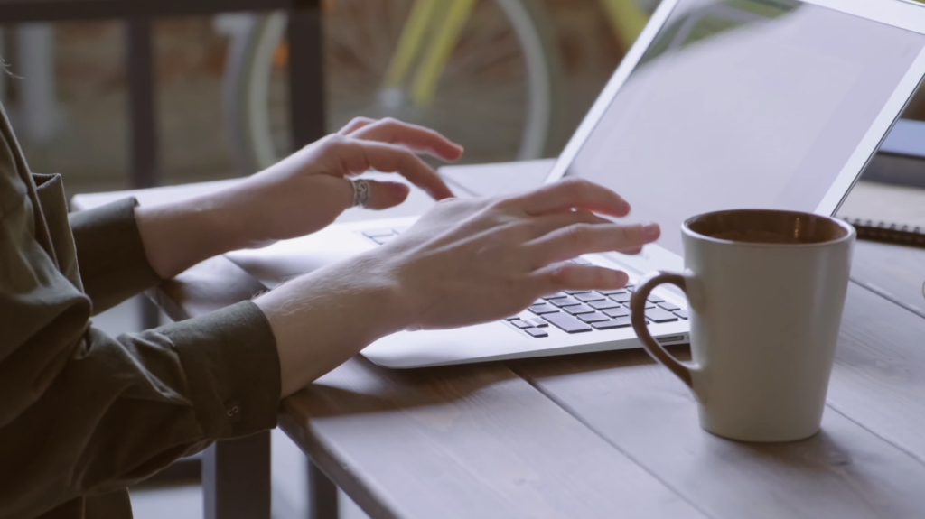 Person typing on laptop large