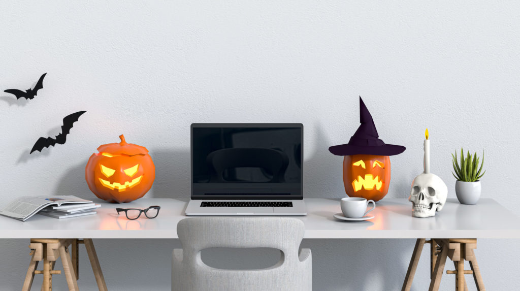 Halloween party interior living room with laptop