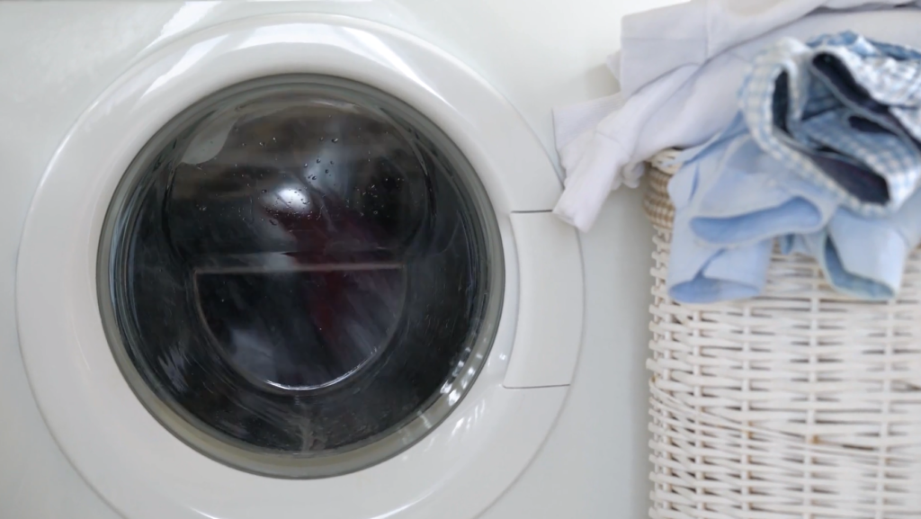 Washing machine video with clothes on hamper